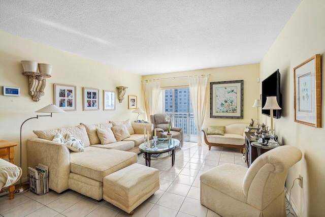 tiled living room featuring a textured ceiling