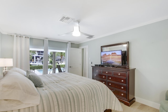 bedroom with ceiling fan, light wood-type flooring, ornamental molding, and access to outside