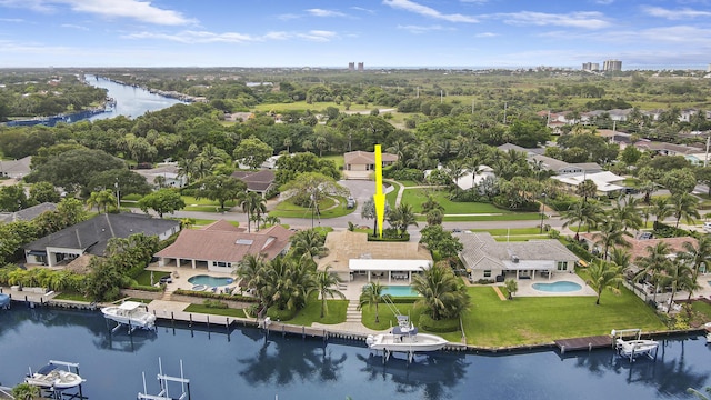 birds eye view of property with a water view