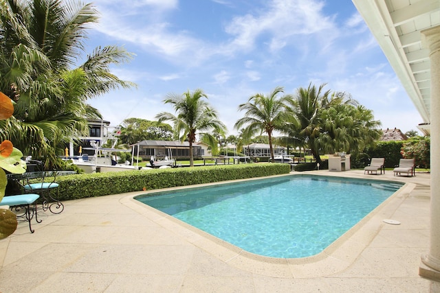 view of swimming pool with a patio