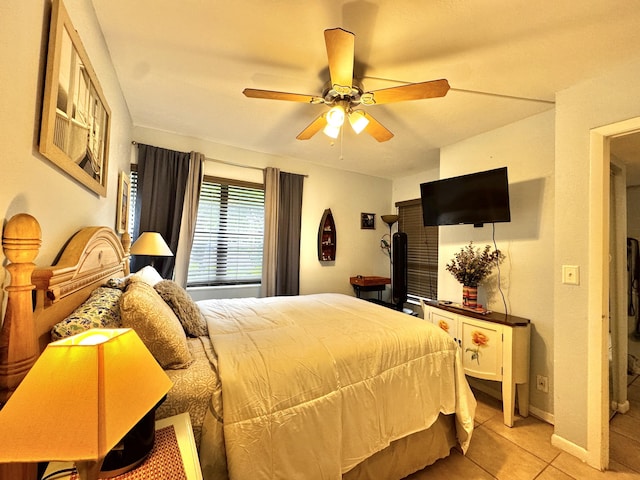 bedroom with ceiling fan and light tile patterned floors