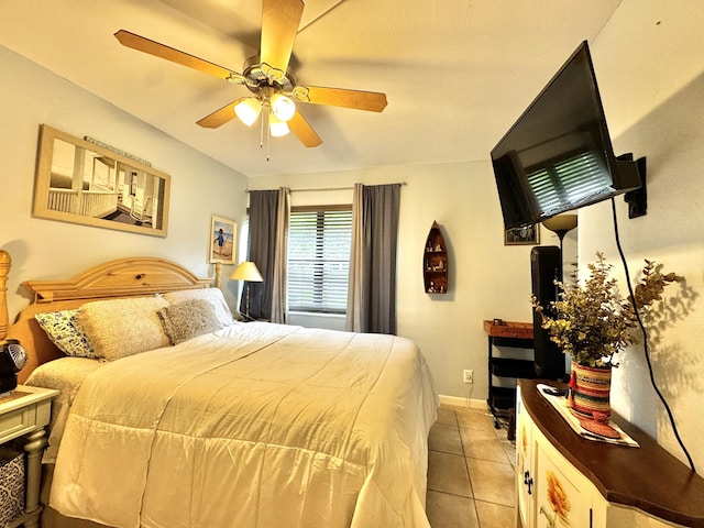 tiled bedroom with ceiling fan