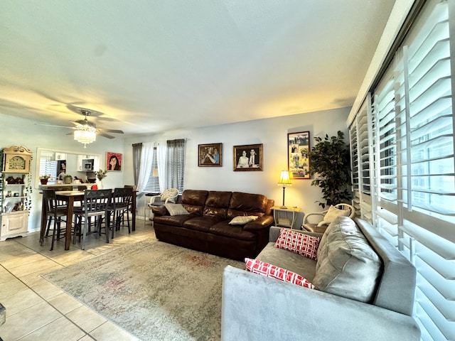 living room featuring tile patterned floors and ceiling fan