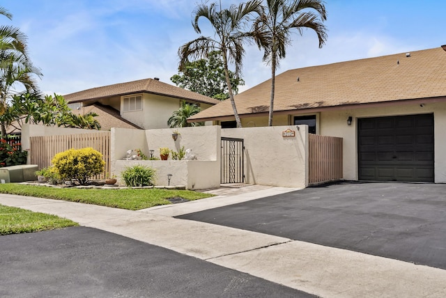 view of front of property featuring a garage