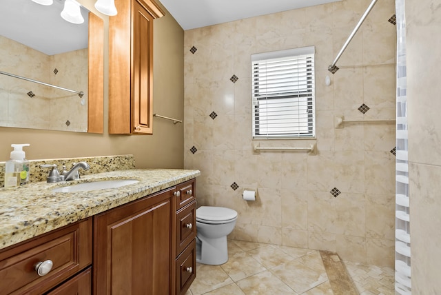 bathroom with tile patterned flooring, vanity, toilet, and a shower with shower curtain