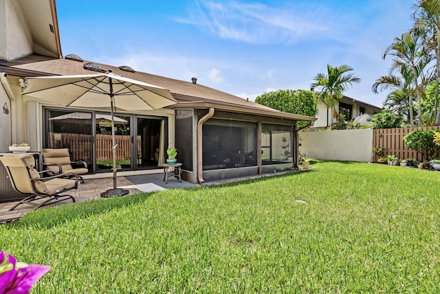 view of yard featuring a patio area and a sunroom