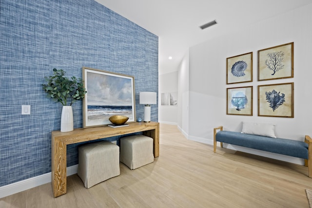 home office with recessed lighting, light wood-type flooring, visible vents, and baseboards