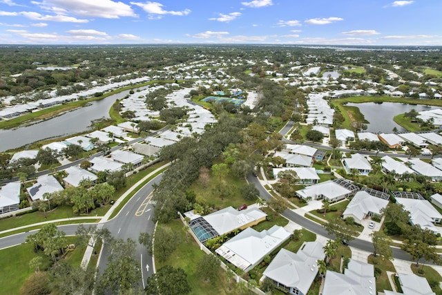 birds eye view of property with a water view and a residential view