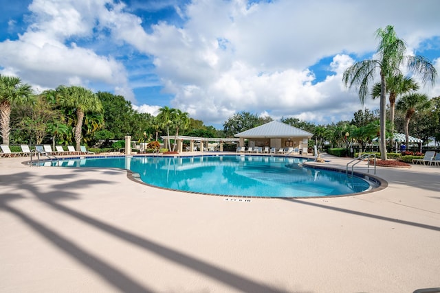 community pool featuring a patio area