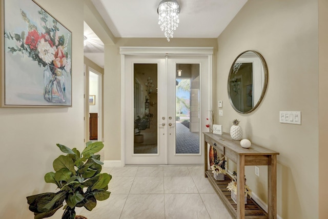 doorway featuring a chandelier and french doors