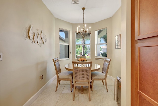 dining space featuring a notable chandelier