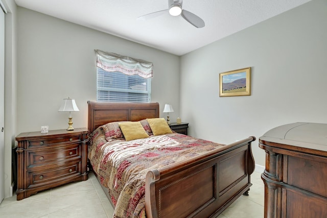 bedroom featuring ceiling fan and light tile patterned floors