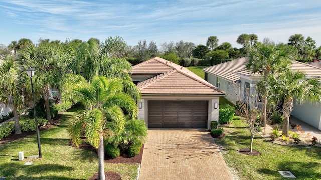 view of front of home with a garage and a front yard