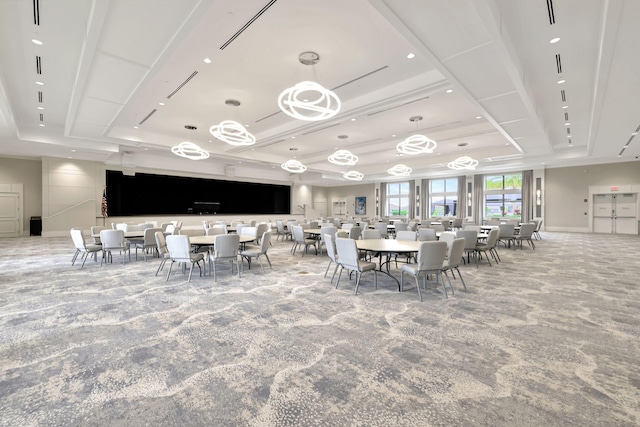 dining area with a raised ceiling