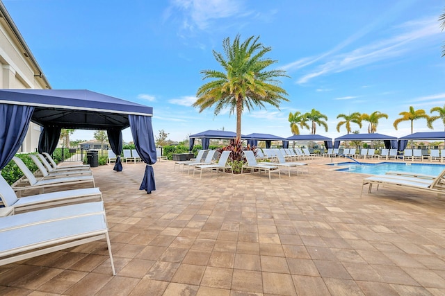 view of patio with a gazebo and a community pool