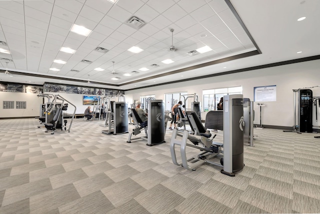 exercise room featuring a drop ceiling and light colored carpet