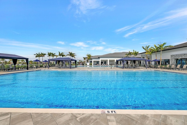 view of pool featuring a gazebo and a patio