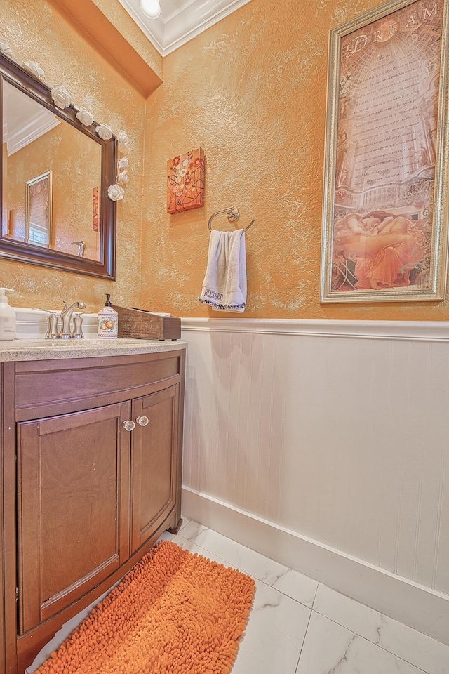 bathroom featuring vanity and ornamental molding