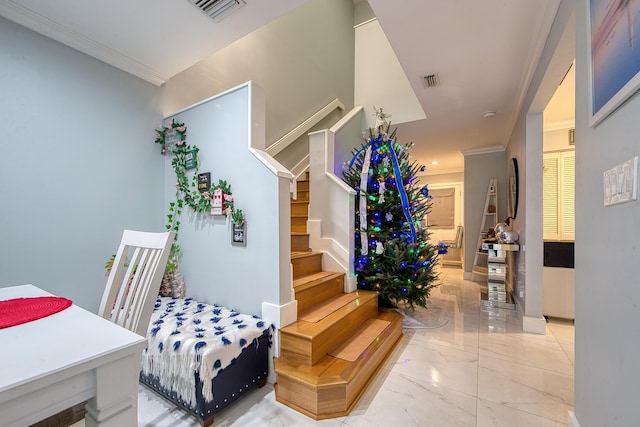 stairs featuring ornamental molding