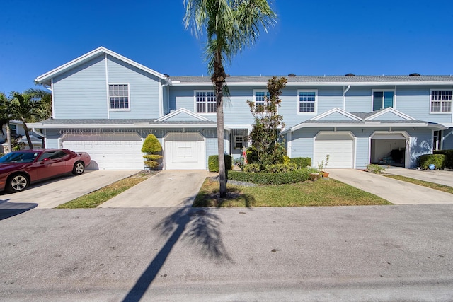 townhome / multi-family property featuring a garage