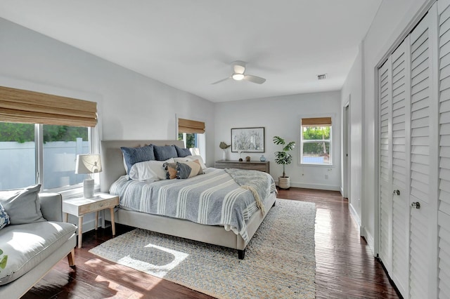 bedroom featuring ceiling fan and dark wood-type flooring