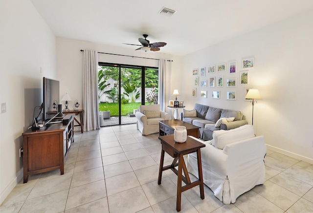 tiled living room with ceiling fan