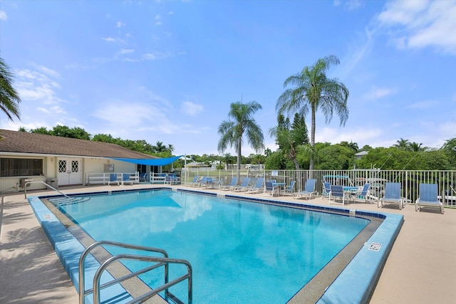 view of swimming pool featuring a patio