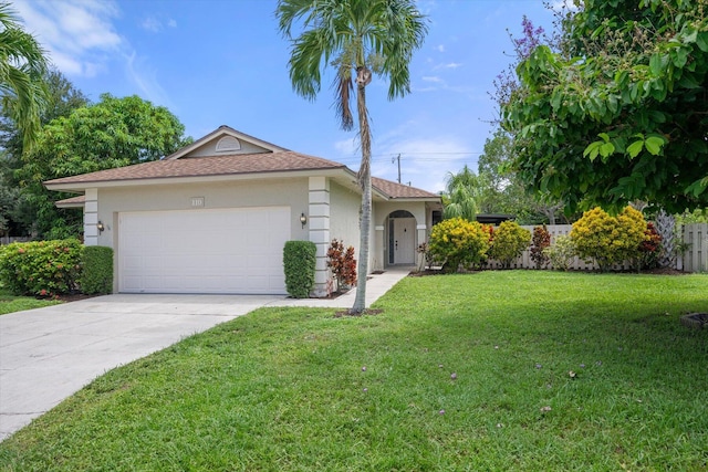 ranch-style home with a garage and a front yard