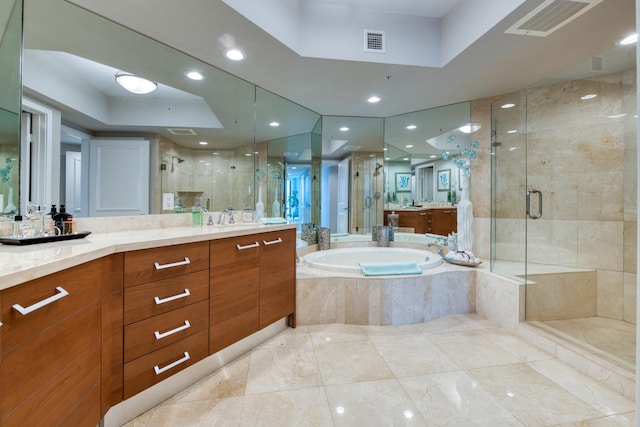 bathroom featuring plus walk in shower and vanity