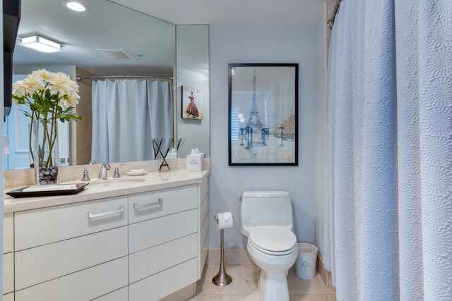 bathroom with tile patterned floors, vanity, and toilet