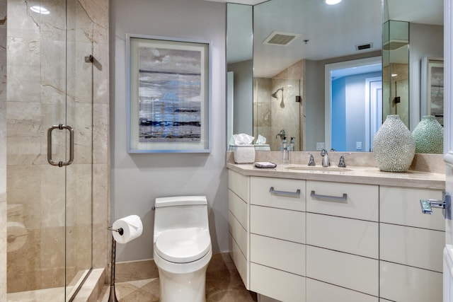 bathroom with vanity, toilet, and walk in shower