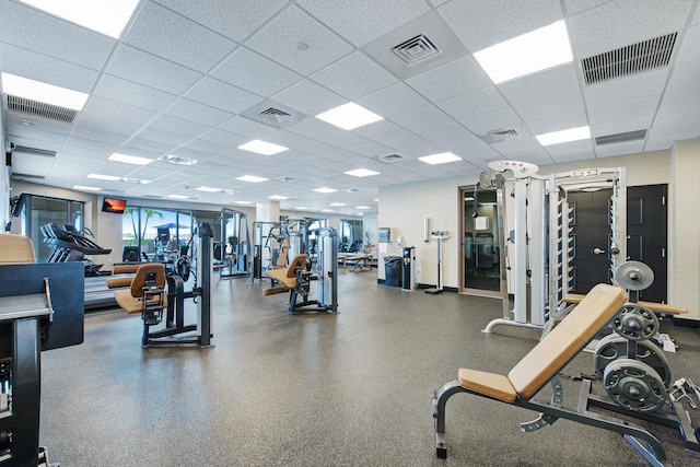 gym featuring a paneled ceiling