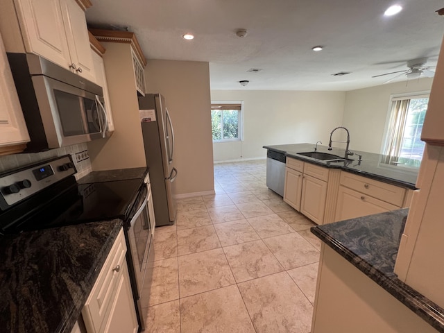 kitchen with ceiling fan, sink, plenty of natural light, and appliances with stainless steel finishes