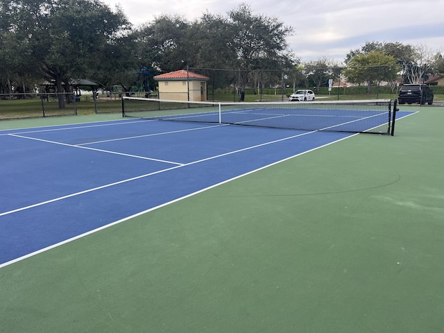 view of sport court featuring basketball hoop