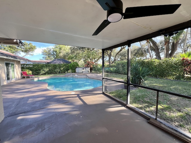 view of pool with ceiling fan and a patio