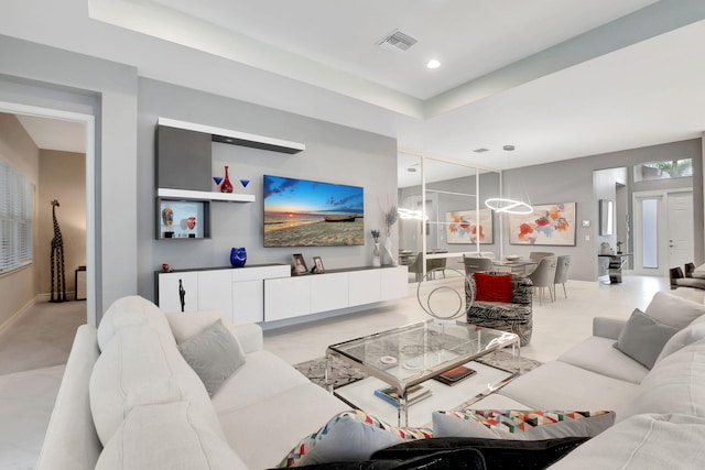 living room with a raised ceiling