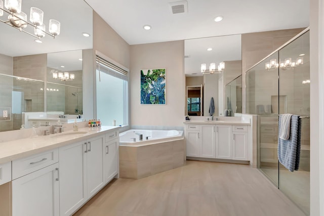 bathroom with plus walk in shower and vanity