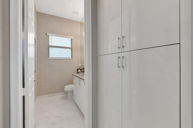 bathroom with vanity and toilet