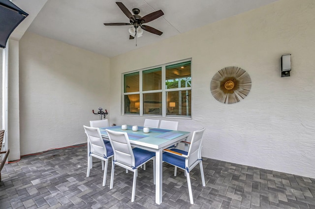 view of patio featuring ceiling fan