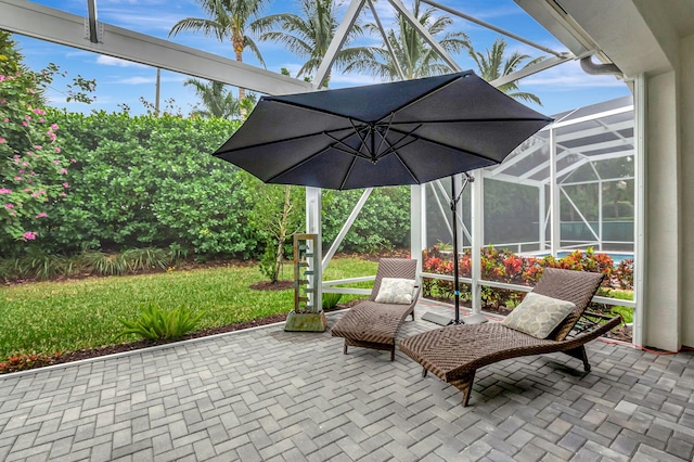 view of patio with glass enclosure