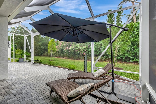 view of patio / terrace featuring glass enclosure