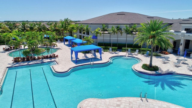 view of swimming pool featuring a patio area