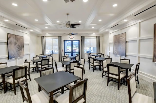 dining space featuring light carpet, coffered ceiling, french doors, ceiling fan, and beam ceiling