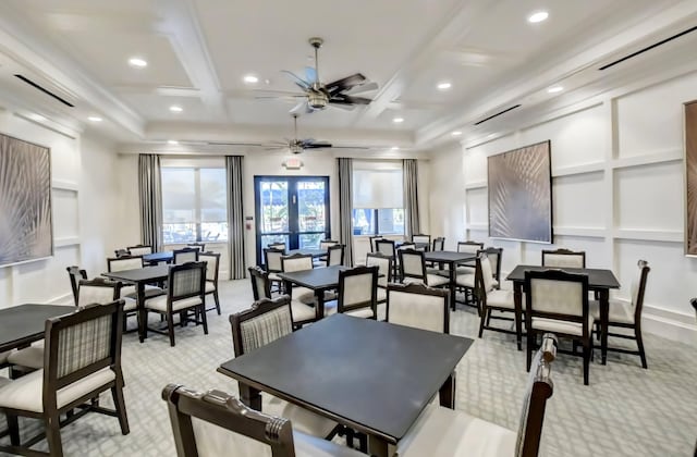 carpeted dining room with beamed ceiling, french doors, ceiling fan, and coffered ceiling