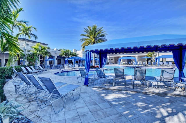 view of patio / terrace with a gazebo and a community pool