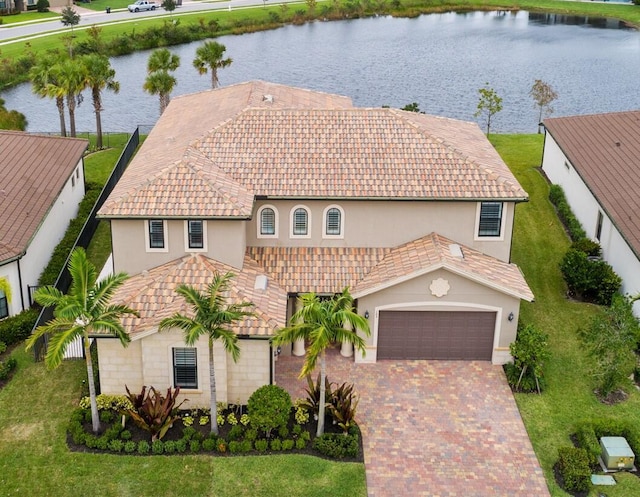 view of front of home featuring a water view and a garage