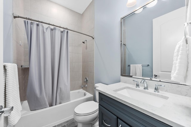 full bathroom with shower / bath combo, vanity, and toilet