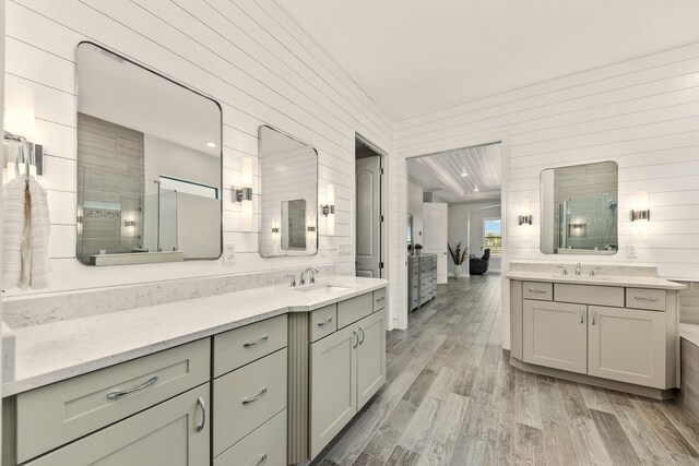 bathroom featuring vanity, wood-type flooring, and toilet