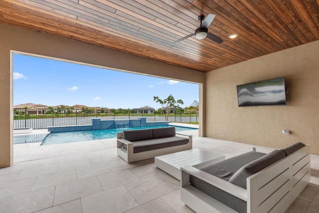 view of patio / terrace with pool water feature, ceiling fan, and a fenced in pool