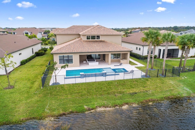 view of swimming pool with a yard, an outdoor hangout area, a water view, and a patio